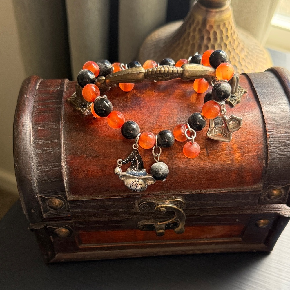 Elegant Black and Orange Beaded Bracelet with Charms